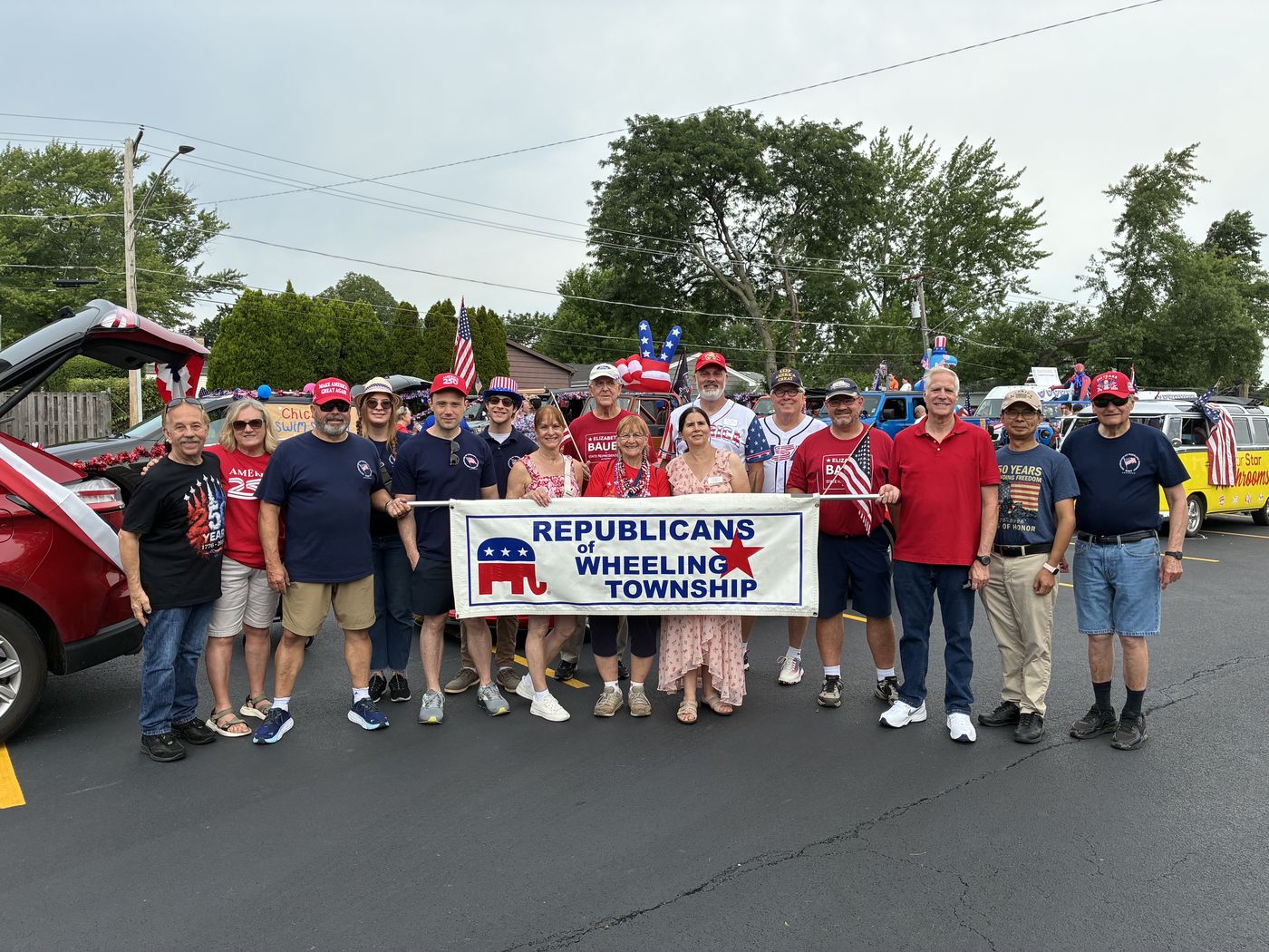 ROWT members and volunteers with the Republicans of Wheeling Township banner at the Arlington Heights Independence Day Parade