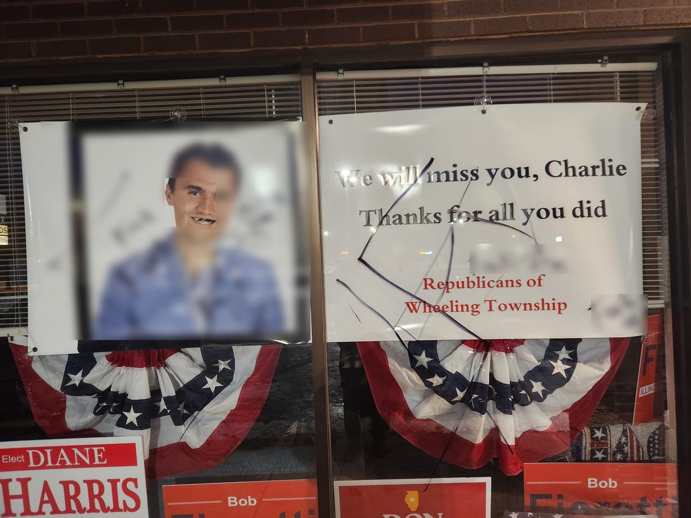 The ROWT office memorial to Charlie Kirk, defaced with profanity in the January 2026 attack; profanity has been blurred